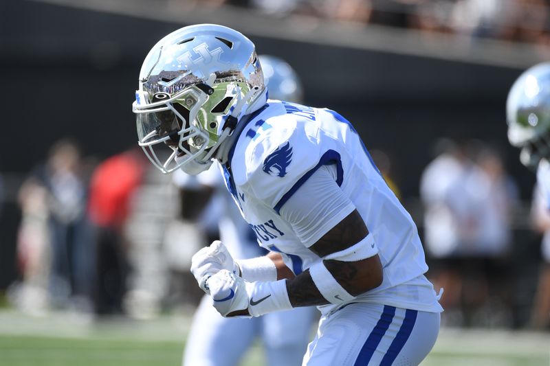 Sep 23, 2023; Nashville, Tennessee, USA; Kentucky Wildcats defensive back Zion Childress (11) celebrates after a defensive stop against the Vanderbilt Commodores during the first half at FirstBank Stadium. Mandatory Credit: Christopher Hanewinckel-USA TODAY Sports