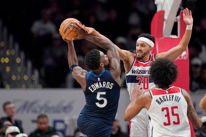 WASHINGTON, DC - JANUARY 24: Anthony Edwards #5 of the Minnesota Timberwolves goes up against Landry Shamet #20 of the Washington Wizards during the second half at Capital One Arena on January 24, 2024 in Washington, DC. NOTE TO USER: User expressly acknowledges and agrees that, by downloading and or using this photograph, User is consenting to the terms and conditions of the Getty Images License Agreement. (Photo by Jess Rapfogel/Getty Images)