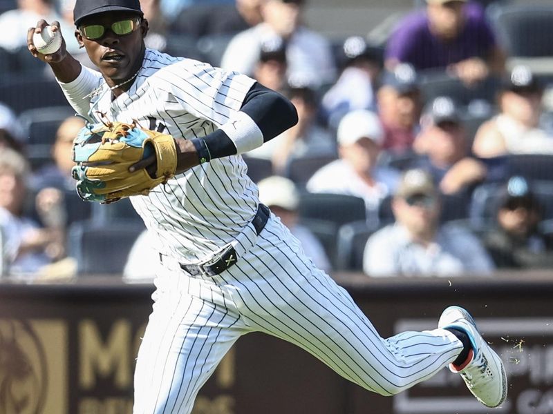 Aug 24, 2024; Bronx, New York, USA;  New York Yankees third baseman Jazz Chisholm Jr. (13) makes a running throw to fist base in the fifth inning against the Colorado Rockies at Yankee Stadium. Mandatory Credit: Wendell Cruz-USA TODAY Sports