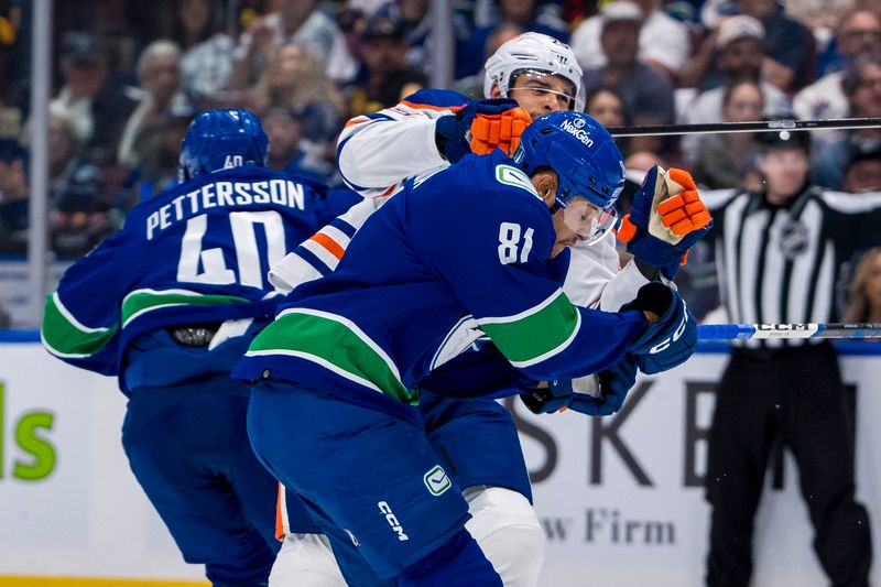 May 10, 2024; Vancouver, British Columbia, CAN; Vancouver Canucks forward Dakota Joshua (81) checks Edmonton Oilers defenseman Darnell Nurse (25) during the second period in game two of the second round of the 2024 Stanley Cup Playoffs at Rogers Arena. Mandatory Credit: Bob Frid-USA TODAY Sports