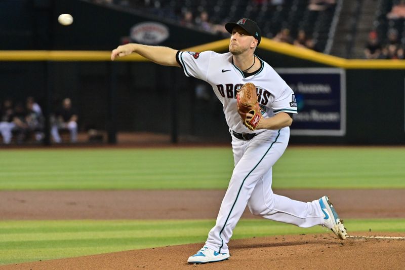 Sep 20, 2023; Phoenix, Arizona, USA;  Arizona Diamondbacks starting pitcher Merrill Kelly (29) throws in the first inning against the San Francisco Giants at Chase Field. Mandatory Credit: Matt Kartozian-USA TODAY Sports