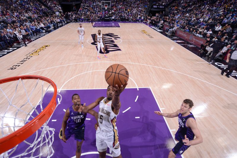 SACRAMENTO, CA - JANUARY 7:  Herb Jones #5 of the New Orleans Pelicans goes to the basket during the game on January 7, 2024 at Golden 1 Center in Sacramento, California. NOTE TO USER: User expressly acknowledges and agrees that, by downloading and or using this Photograph, user is consenting to the terms and conditions of the Getty Images License Agreement. Mandatory Copyright Notice: Copyright 2024 NBAE (Photo by Rocky Widner/NBAE via Getty Images)