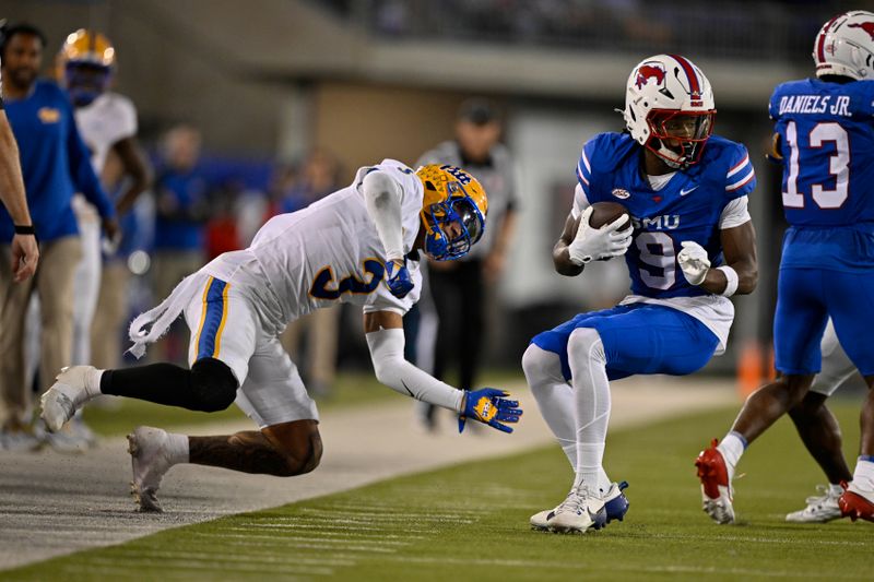 Nov 2, 2024; Dallas, Texas, USA; Southern Methodist Mustangs wide receiver Key'Shawn Smith (9) breaks the tackle of Pittsburgh Panthers defensive back Donovan McMillon (3) during the second half at Gerald J. Ford Stadium. Mandatory Credit: Jerome Miron-Imagn Images