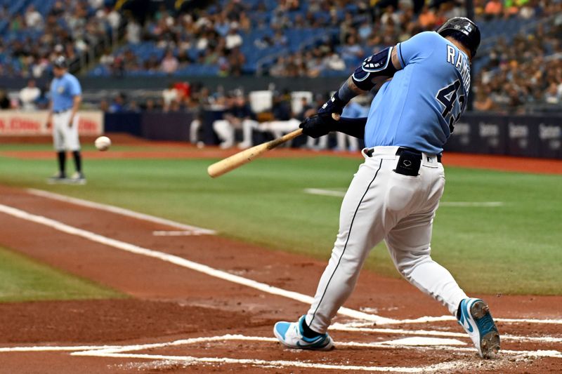 Sep 10, 2023; St. Petersburg, Florida, USA; Tampa Bay Rays designated hitter Harold Ramirez (43) hits a two RBI double in the first inning against the Seattle Mariners  at Tropicana Field. Mandatory Credit: Jonathan Dyer-USA TODAY Sports