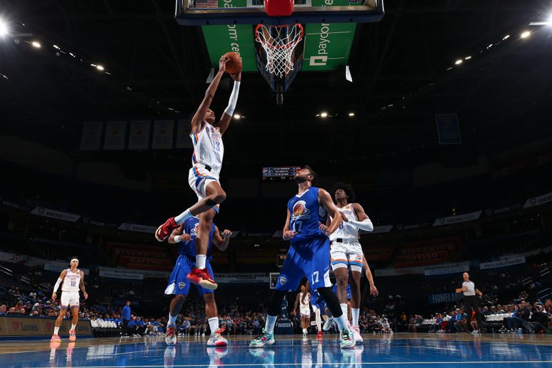 OKLAHOMA CITY, OK - OCTOBER 9: Ousmane Dieng #13 of the Oklahoma City Thunder drives to the basket during the game against  on October 9, 2022 at Paycom Arena in Oklahoma City, Oklahoma. NOTE TO USER: User expressly acknowledges and agrees that, by downloading and or using this photograph, User is consenting to the terms and conditions of the Getty Images License Agreement. Mandatory Copyright Notice: Copyright 2022 NBAE (Photo by Zach Beeker/NBAE via Getty Images)