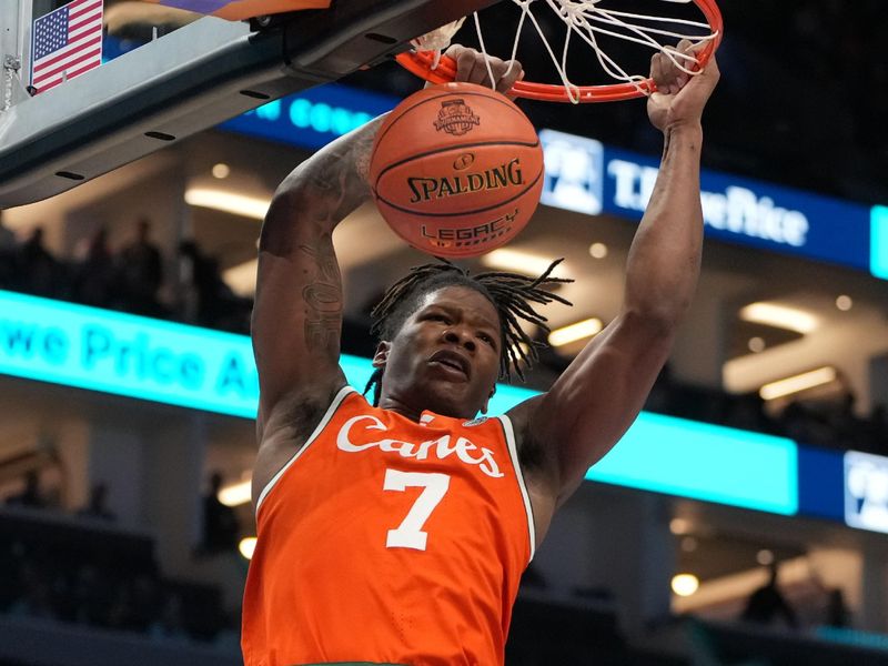 Mar 13, 2026; Charlotte, NC, USA; Miami (FL) Hurricanes forward Shelton Henderson (7) scores in the first half at Spectrum Center. Mandatory Credit: Bob Donnan-Imagn Images