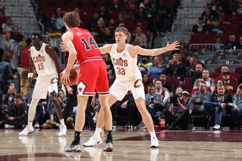 CLEVELAND, OH - OCTOBER 8: Luke Travers #33 of the Cleveland Cavaliers plays defense against the Chicago Bulls on October 8, 2024 at Rocket Mortgage FieldHouse in Cleveland, Ohio. NOTE TO USER: User expressly acknowledges and agrees that, by downloading and/or using this Photograph, user is consenting to the terms and conditions of the Getty Images License Agreement. Mandatory Copyright Notice: Copyright 2024 NBAE (Photo by Jeff Haynes/NBAE via Getty Images)