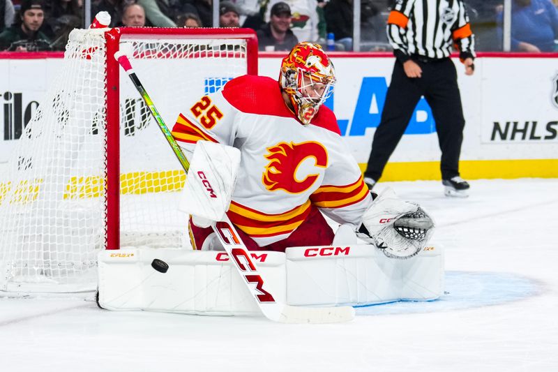 Jan 2, 2024; Saint Paul, Minnesota, USA; Calgary Flames goaltender Jacob Markstrom (25) makes a save during the second period against the Minnesota Wild at Xcel Energy Center. Mandatory Credit: Brace Hemmelgarn-USA TODAY Sports