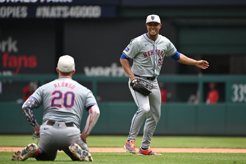 Jul 4, 2024; Washington, District of Columbia, USA; New York Mets starting pitcher Jose Quintana (62) looks back at first baseman Pete Alonso (20) after colliding with each other against the Washington Nationals during the seventh inning at Nationals Park. Mandatory Credit: Rafael Suanes-USA TODAY Sports