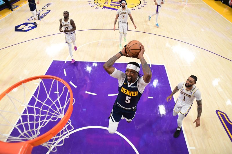 LOS ANGELES, CA - APRIL 27: Kentavious Caldwell-Pope #5 of the Denver Nuggets drives to the basket during the games against the Los Angeles Lakers during Round 1 Game 4 of the 2024 NBA Playoffs on April 27, 2024 at Crypto.Com Arena in Los Angeles, California. NOTE TO USER: User expressly acknowledges and agrees that, by downloading and/or using this Photograph, user is consenting to the terms and conditions of the Getty Images License Agreement. Mandatory Copyright Notice: Copyright 2024 NBAE (Photo by Adam Pantozzi/NBAE via Getty Images)