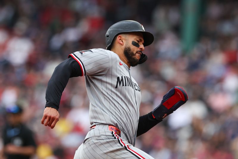 May 4, 2025; Boston, Massachusetts, USA; Minnesota Twins shortstop Carlos Correa (4) rounds third base during the eighth inning against the Boston Red Sox at Fenway Park. Mandatory Credit: Paul Rutherford-Imagn Images