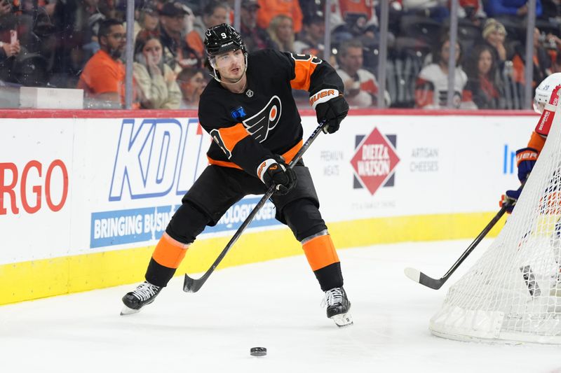Apr 12, 2025; Philadelphia, Pennsylvania, USA; Philadelphia Flyers defenseman Jamie Drysdale (9) passes the puck against the New York Islanders in the first period at Wells Fargo Center. Mandatory Credit: Kyle Ross-Imagn Images