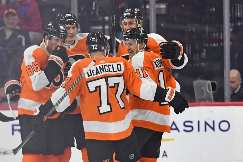 Oct 13, 2022; Philadelphia, Pennsylvania, USA; Philadelphia Flyers right wing Travis Konecny (11) celebrates his goal with teammates against the New Jersey Devils during the third period at Wells Fargo Center. Mandatory Credit: Eric Hartline-USA TODAY Sports