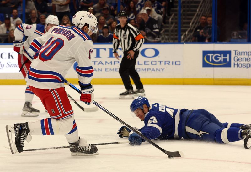 Mar 14, 2024; Tampa, Florida, USA; New York Rangers left wing Artemi Panarin (10) skates with the puck as Tampa Bay Lightning defenseman Darren Raddysh (43) defends  during the second period at Amalie Arena. Mandatory Credit: Kim Klement Neitzel-USA TODAY Sports