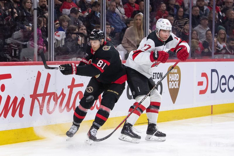 Apr 6, 2024; Ottawa, Ontario, CAN; Ottawa Senators left wing Dominik Kubalik (81) moves the puck away from New Jersey Devils defenseman Simon Nemec (17) in the first period at the Canadian Tire Centre. Mandatory Credit: Marc DesRosiers-USA TODAY Sports