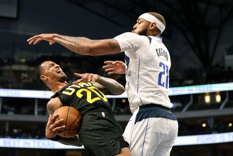 DALLAS, TEXAS - OCTOBER 10: John Collins #20 of the Utah Jazz is fouled by Daniel Gafford #21 of the Dallas Mavericks in the second half at American Airlines Center on October 10, 2024 in Dallas, Texas. NOTE TO USER: User expressly acknowledges and agrees that, by downloading and or using this Photograph, user is consenting to the terms and conditions of the Getty Images License Agreement. Mandatory Copyright Notice: Copyright 2024 NBAE  (Photo by Tim Heitman/Getty Images)