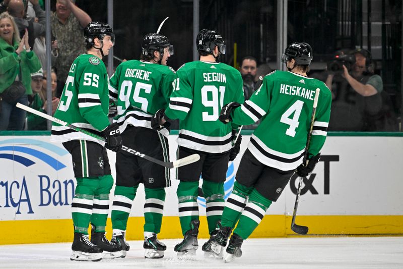 Jan 25, 2024; Dallas, Texas, USA; Dallas Stars defenseman Thomas Harley (55) and center Matt Duchene (95) and center Tyler Seguin (91) and defenseman Miro Heiskanen (4) celebrates a goal scored by Duchene against the Anaheim Ducks during the first period at the American Airlines Center. Mandatory Credit: Jerome Miron-USA TODAY Sports