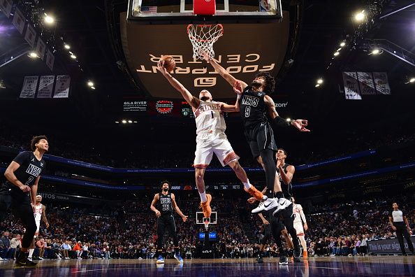 PHOENIX, AZ - DECEMBER 13: Devin Booker #1 of the Phoenix Suns drives to the basket during the game against the Brooklyn Nets on December 13, 2023 at Footprint Center in Phoenix, Arizona. NOTE TO USER: User expressly acknowledges and agrees that, by downloading and or using this photograph, user is consenting to the terms and conditions of the Getty Images License Agreement. Mandatory Copyright Notice: Copyright 2023 NBAE (Photo by Barry Gossage/NBAE via Getty Images)