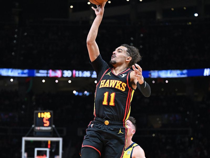 ATLANTA, GA - JANUARY 12: Trae Young #11 of the Atlanta Hawks shoots the ball during the game against the Indiana Pacers on January 12, 2024 at State Farm Arena in Atlanta, Georgia.  NOTE TO USER: User expressly acknowledges and agrees that, by downloading and/or using this Photograph, user is consenting to the terms and conditions of the Getty Images License Agreement. Mandatory Copyright Notice: Copyright 2024 NBAE (Photo by Adam Hagy/NBAE via Getty Images)