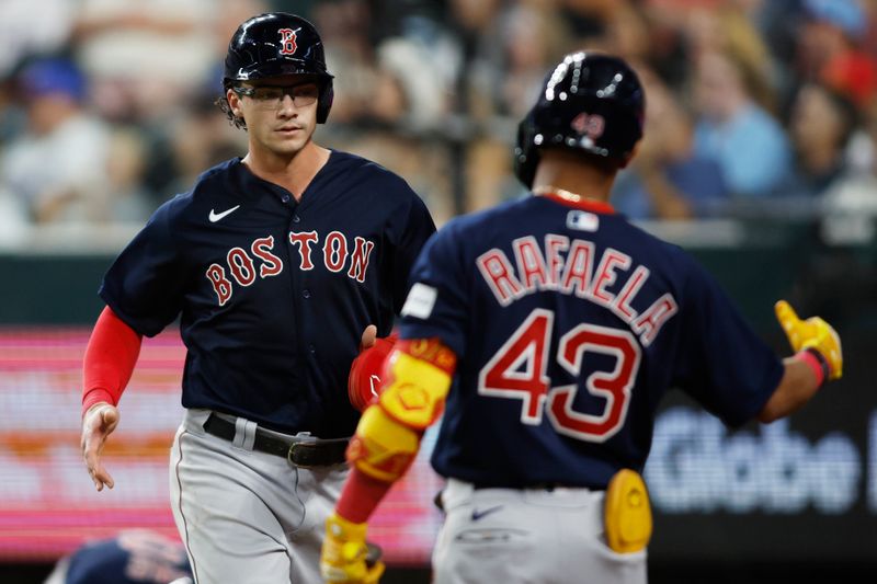 Sep 18, 2023; Arlington, Texas, USA; Boston Red Sox first baseman Bobby Dalbec (29) is congratulated by center fielder Ceddanne Rafaela (43) after scoring a run in the fifth inning against the Texas Rangers at Globe Life Field. Mandatory Credit: Tim Heitman-USA TODAY Sports