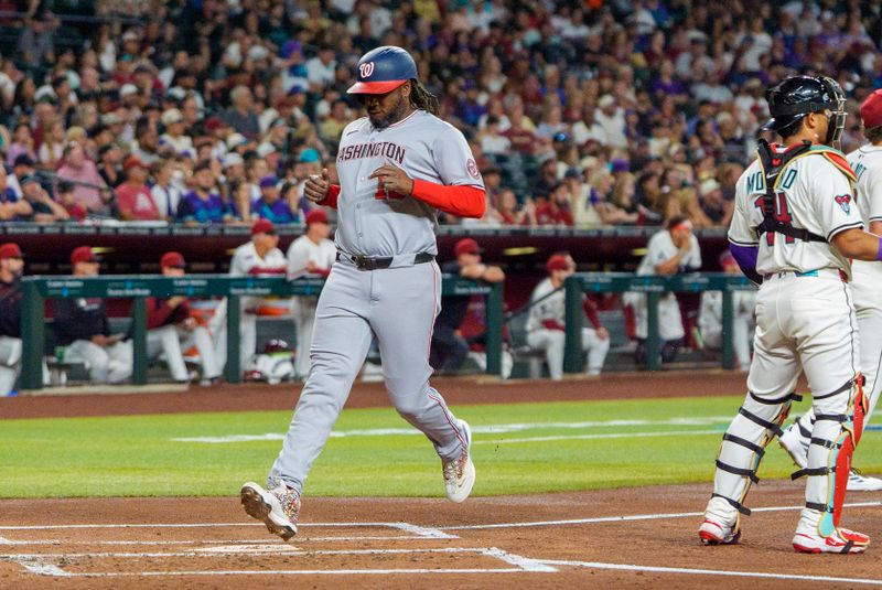 May 31, 2025; Phoenix, Arizona, USA;  Washington Nationals infielder Josh Bell (19) celebrates after scoring in the first inning against the Arizona Diamondbacks at Chase Field. Mandatory Credit: Allan Henry-Imagn Images