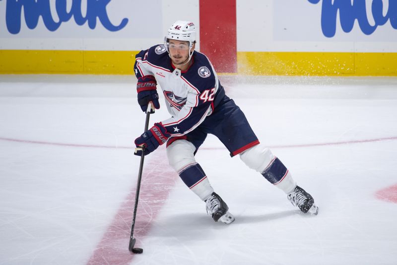 Feb 13, 2024; Ottawa, Ontario, CAN; Columbus Blue Jackets cener Alexandre Texier (42) skates with the puck in the third period against the Ottawa Senators at the Canadian Tire Centre. Mandatory Credit: Marc DesRosiers-USA TODAY Sports