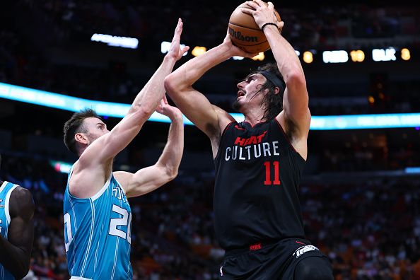 MIAMI, FLORIDA - DECEMBER 13: Jaime Jaquez Jr. #11 of the Miami Heat shoots the ball against the Charlotte Hornets during the second quarter of the game at Kaseya Center on December 13, 2023 in Miami, Florida. NOTE TO USER: User expressly acknowledges and agrees that, by downloading and or using this photograph, User is consenting to the terms and conditions of the Getty Images License Agreement. (Photo by Megan Briggs/Getty Images)