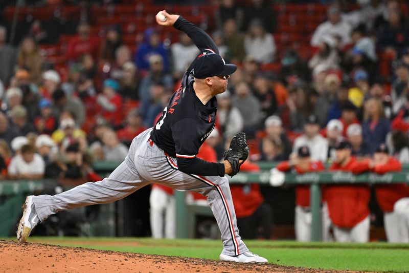 Sep 22, 2024; Boston, MA, USA;  Minnesota Twins pitcher Caleb Thielbar (56) pitches against the Boston Red Sox during the eighth inning at Fenway Park. Mandatory Credit: Eric Canha-Imagn Images