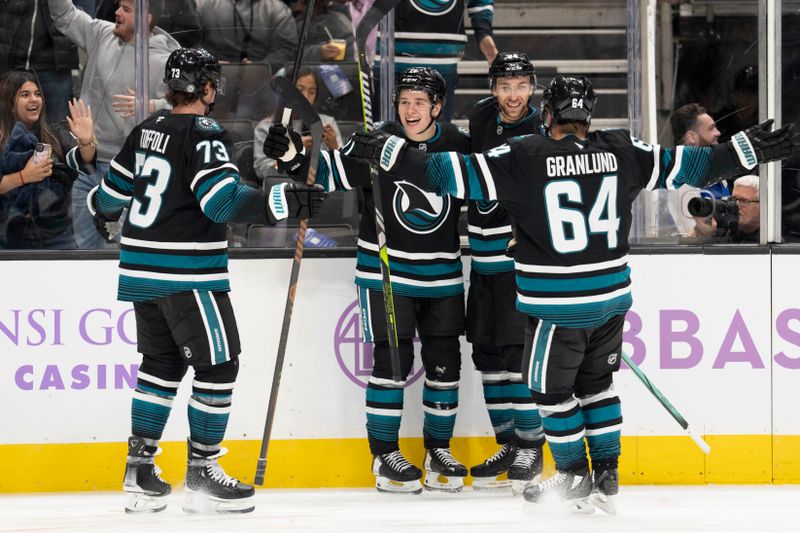 Nov 7, 2024; San Jose, California, USA;  San Jose Sharks center Macklin Celebrini (71) celebrates with teammates after scoring a goal during the second period against the Minnesota Wild at SAP Center at San Jose. Mandatory Credit: Stan Szeto-Imagn Images