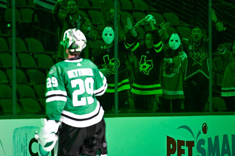 Oct 27, 2022; Dallas, Texas, USA; Dallas Stars goaltender Jake Oettinger (29) skates towards Stars fans in Halloween goalie masks after the Stars victory over the Washington Capitals at the American Airlines Center. Mandatory Credit: Jerome Miron-USA TODAY Sports