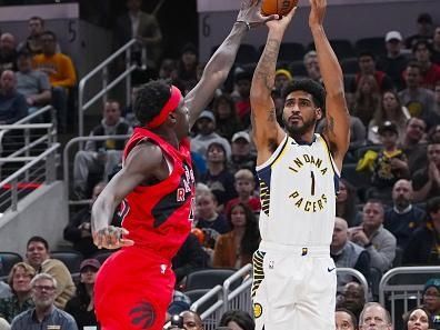 INDIANAPOLIS, INDIANA - NOVEMBER 22: Obi Toppin #1 of the Indiana Pacers attempts a shot while being guarded by Pascal Siakam #43 of the Toronto Raptors in the first quarter at Gainbridge Fieldhouse on November 22, 2023 in Indianapolis, Indiana. NOTE TO USER: User expressly acknowledges and agrees that, by downloading and or using this photograph, User is consenting to the terms and conditions of the Getty Images License Agreement. (Photo by Dylan Buell/Getty Images)