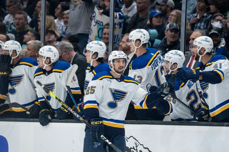 Oct 19, 2022; Seattle, Washington, USA; St. Louis Bluesforward Jordan Kyrou (25) celebrates with teammates on the bench after scoring a goal during the first period against Seattle Kraken at Climate Pledge Arena. Mandatory Credit: Stephen Brashear-USA TODAY Sports