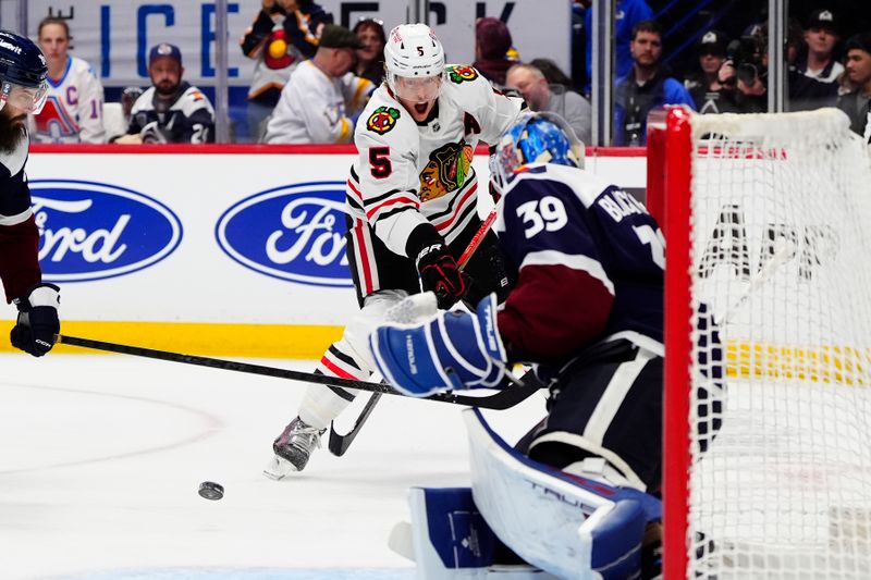 Feb 28, 2026; Denver, Colorado, USA; Chicago Blackhawks defenseman Connor Murphy (5) shoots the puck at Colorado Avalanche goaltender MacKenzie Blackwood (39) in the first period at Ball Arena. Mandatory Credit: Ron Chenoy-Imagn Images Feb 28, 2026; Denver, Colorado, USA; Chicago Blackhawks defenseman Connor Murphy (5) shoots the puck at Colorado Avalanche goaltender MacKenzie Blackwood (39) in the first period at Ball Arena. Mandatory Credit: Ron Chenoy-Imagn Images