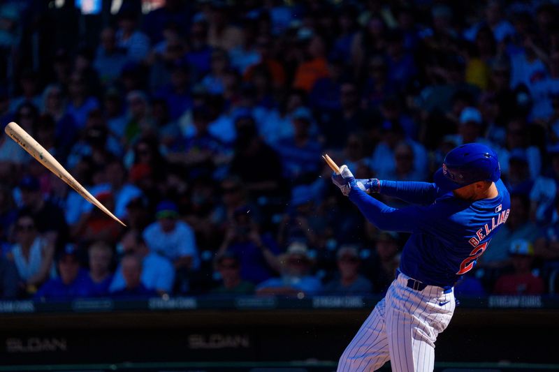 Mar 22, 2024; Mesa, Arizona, USA; Chicago Cubs outfielder Cody Bellinger (24) reacts as his bat breaks for a single in the sixth inning during a spring training game against the San Francisco Giants at Sloan Park. Mandatory Credit: Allan Henry-USA TODAY Sports