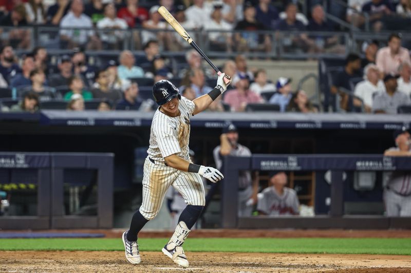 Jun 21, 2024; Bronx, New York, USA; New York Yankees shortstop Anthony Volpe (11) reacts after popping up in the sixth inning against the Atlanta Braves at Yankee Stadium. Mandatory Credit: Wendell Cruz-USA TODAY Sports