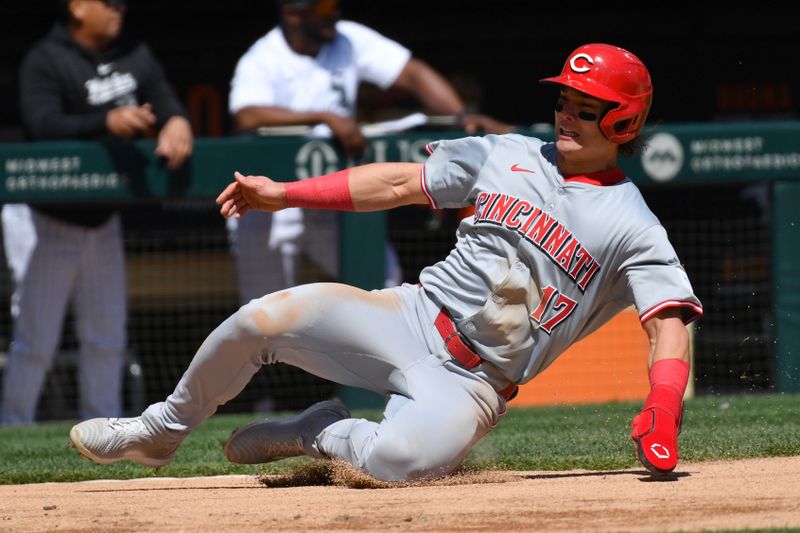 Apr 13, 2024; Chicago, Illinois, USA; Cincinnati Reds right fielder Stuart Fairchild (17) slides into home plate to score during the second inning against the Chicago White Sox at Guaranteed Rate Field. Mandatory Credit: Patrick Gorski-USA TODAY Sports