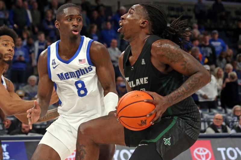 Feb 11, 2024; Memphis, Tennessee, USA; Tulane Green Wave forward Kevin Cross (24) drives to the basket as Memphis Tigers forward David Jones (8) defends during the second half at FedExForum. Mandatory Credit: Petre Thomas-USA TODAY Sports