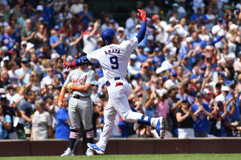 Aug 22, 2024; Chicago, Illinois, USA; Chicago Cubs catcher Miguel Amaya (9) celebrates his grand slam while rounding the bases during the second inning against the Detroit Tigers at Wrigley Field. Mandatory Credit: Patrick Gorski-USA TODAY Sports