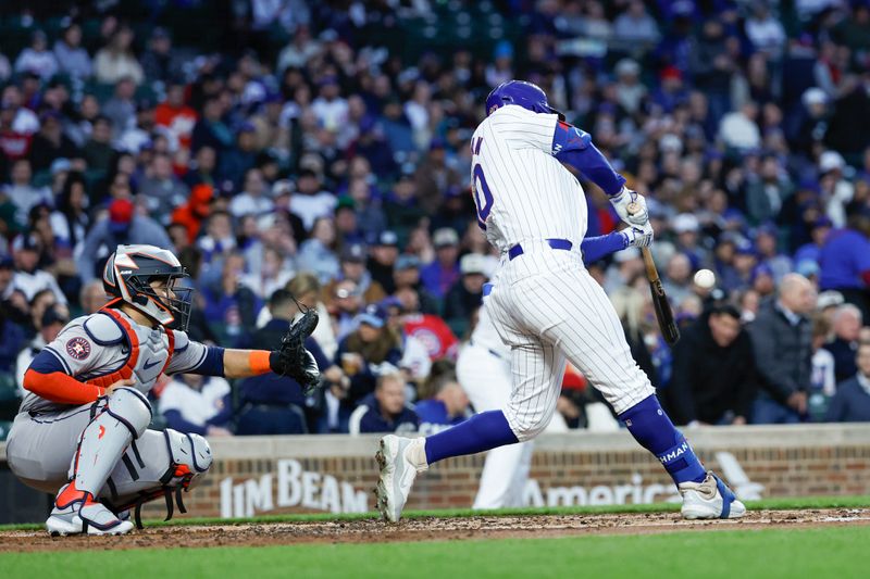 Apr 23, 2024; Chicago, Illinois, USA; Chicago Cubs outfielder Mike Tauchman (40) hits a three-run home run against the Houston Astros during the first inning at Wrigley Field. Mandatory Credit: Kamil Krzaczynski-USA TODAY Sports