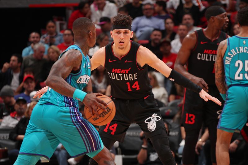 MIAMI, FL - JANUARY 14: Tyler Herro #14 of the Miami Heat plays defense during the game against the Charlotte Hornets on January 14, 2024 at Kaseya Center in Miami, Florida. NOTE TO USER: User expressly acknowledges and agrees that, by downloading and or using this Photograph, user is consenting to the terms and conditions of the Getty Images License Agreement. Mandatory Copyright Notice: Copyright 2024 NBAE (Photo by Issac Baldizon/NBAE via Getty Images)