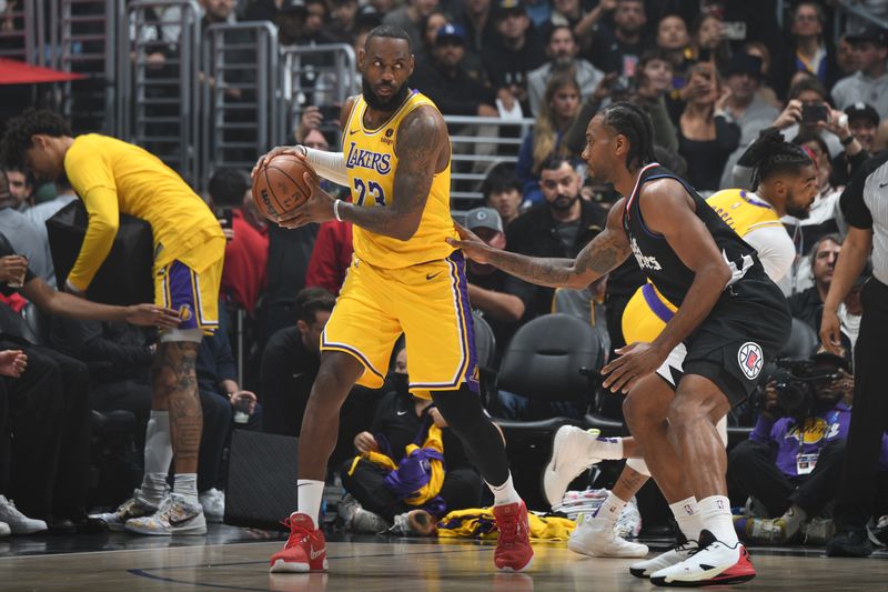 LOS ANGELES, CA - FEBRUARY 28: LeBron James #23 of the Los Angeles Lakers handles the ball during the game against the LA Clippers on February 28, 2024 at Crypto.Com Arena in Los Angeles, California. NOTE TO USER: User expressly acknowledges and agrees that, by downloading and/or using this Photograph, user is consenting to the terms and conditions of the Getty Images License Agreement. Mandatory Copyright Notice: Copyright 2024 NBAE (Photo by Andrew D. Bernstein/NBAE via Getty Images)