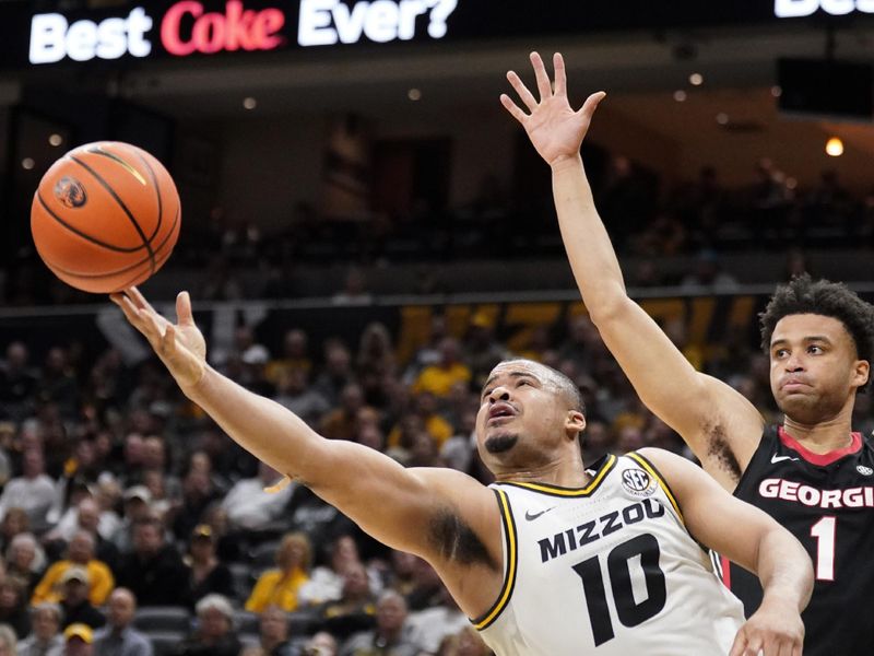 Jan 6, 2024; Columbia, Missouri, USA; Missouri Tigers guard Nick Honor (10) shoots as Georgia Bulldogs guard Jabri Abdur-Rahim (1) looks on during the first half at Mizzou Arena. Mandatory Credit: Denny Medley-USA TODAY Sports