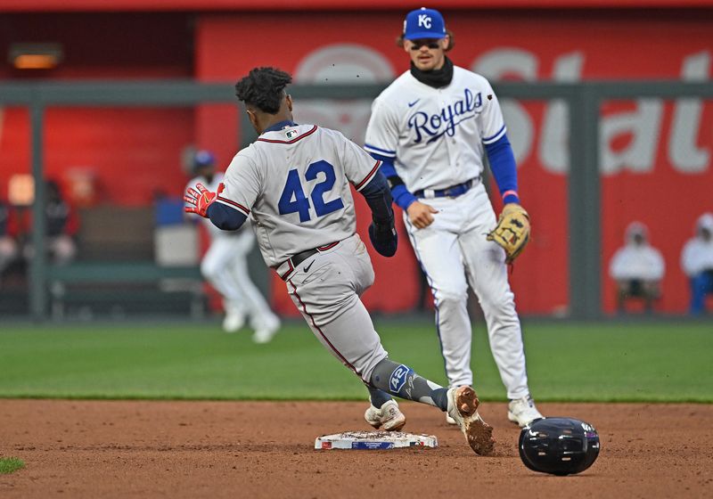 Apr 15, 2023; Kansas City, Missouri, USA;  Atlanta Braves second baseman Ozzie Albies (1) rounds second base past Kansas City Royals shortstop Bobby Witt Jr. (7) during the fifth inning at Kauffman Stadium. Mandatory Credit: Peter Aiken-USA TODAY Sports