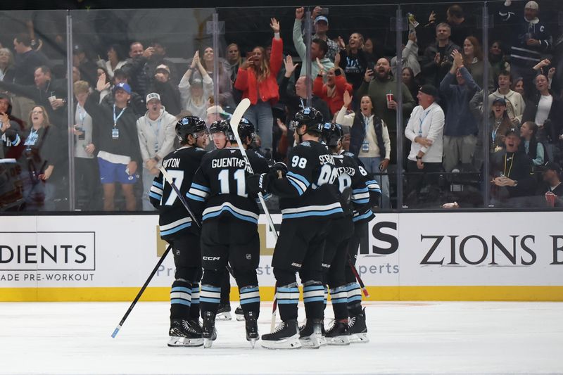 Oct 30, 2024; Salt Lake City, Utah, USA; Utah Hockey Club center Clayton Keller (9) scores a goal against the Calgary Flames during the third period at Delta Center. Mandatory Credit: Rob Gray-Imagn Images