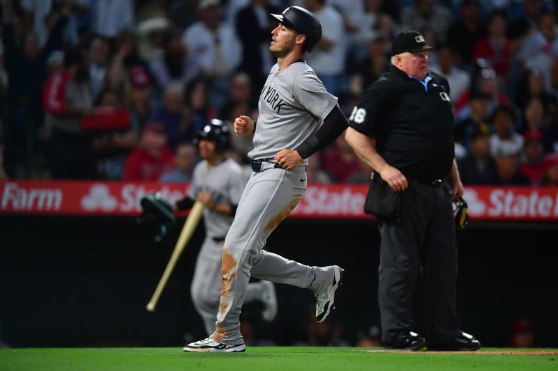 May 27, 2025; Anaheim, California, USA; New York Yankees left fielder Cody Bellinger (35) scores a run against the Los Angeles Angels during the sixth inning at Angel Stadium. Mandatory Credit: Gary A. Vasquez-Imagn Images