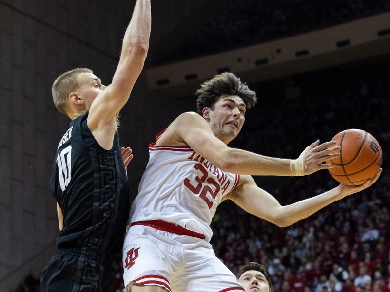 Jan 22, 2023; Bloomington, Indiana, USA; Indiana Hoosiers guard Trey Galloway (32) shoots the ball while Michigan State Spartans forward Joey Hauser (10) defends in the first half at Simon Skjodt Assembly Hall. Mandatory Credit: Trevor Ruszkowski-USA TODAY Sports