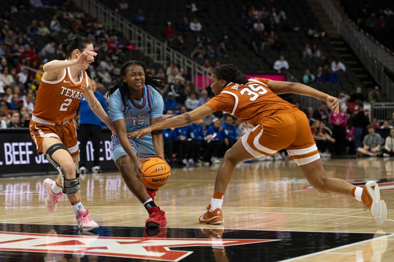 Mar 9, 2024; Kansas City, MO, USA; Kansas Jayhawks guard Zakiyah Franklin (15) drives to the basket while defended by Texas Longhorns guard Shaylee Gonzales (2) and forward Madison Booker (35) during the first half at T-Mobile Center. Mandatory Credit: Amy Kontras-USA TODAY Sports