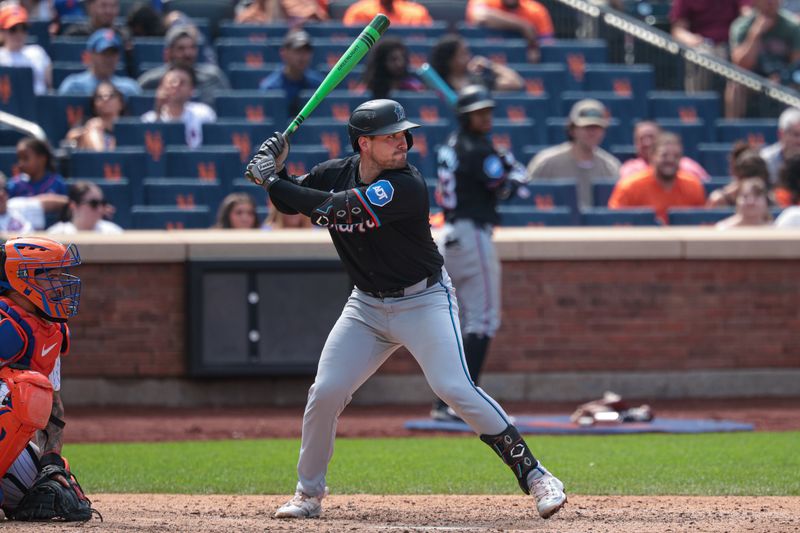 Aug 18, 2024; New York City, New York, USA; Miami Marlins catcher Nick Fortes (4) at bat while using a green light crayon bat against the New York Mets at Citi Field. Mandatory Credit: Vincent Carchietta-USA TODAY Sports