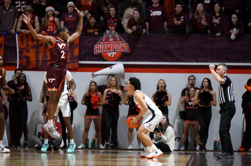 Feb 4, 2023; Blacksburg, Virginia, USA; Virginia Tech Hokies guard Michael Collins Jr. (2) defends as Virginia Cavaliers guard Kihei Clark (0) looks for a open shot in the second half at Cassell Coliseum. Mandatory Credit: Lee Luther Jr.-USA TODAY Sports