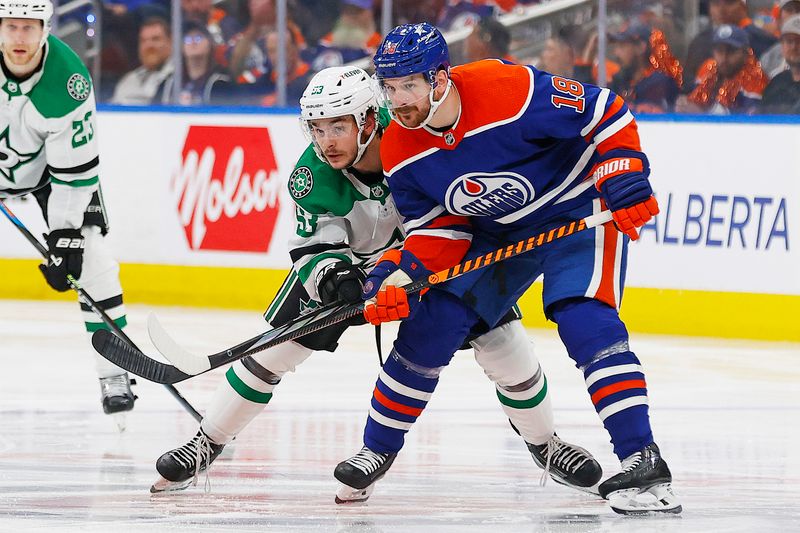 May 27, 2024; Edmonton, Alberta, CAN;   Edmonton Oilers forward Zach Hyman (18) and Dallas Stars forward Wyatt Johnson (53) battle for position during the second period in game three of the Western Conference Final of the 2024 Stanley Cup Playoffs at Rogers Place. Mandatory Credit: Perry Nelson-USA TODAY Sports